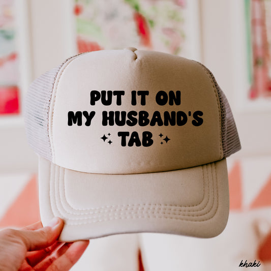 Put It On My Husband's Tab Trucker Hat *12 Colors